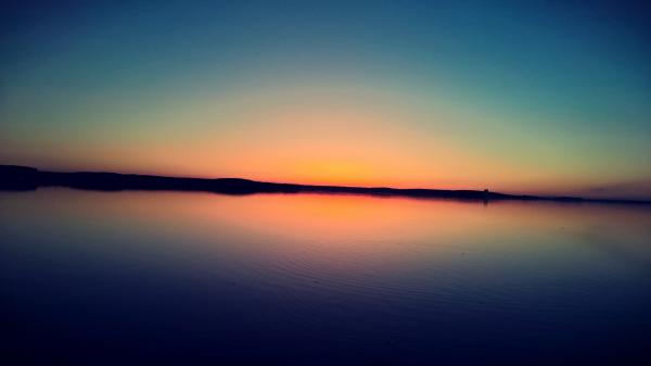 Sunset on Body of Water