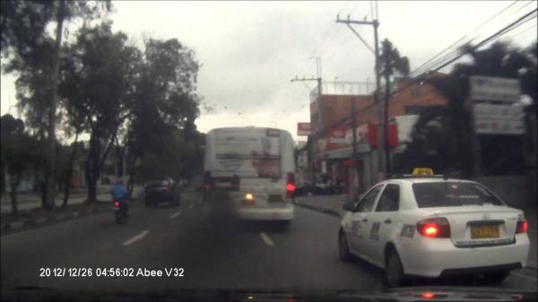 Taxi Overtaking Bus