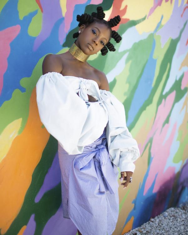 the girl at the colorful wall