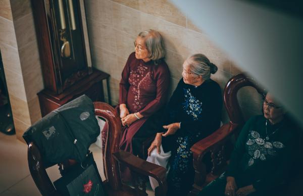 Three Women Sitting on Chairs