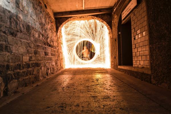 Timelapse Photo of Man in Hallway With Light