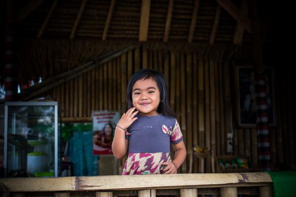 Toddler in Purple and White Dress