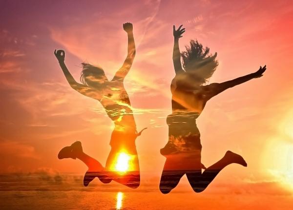 Two Girls Cheering on the Beach