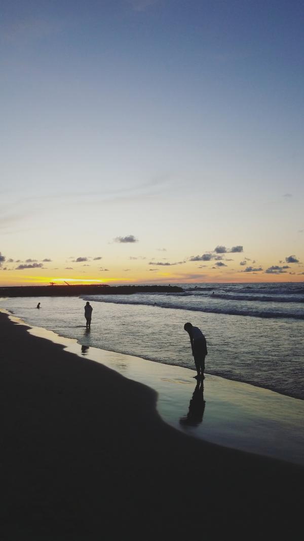 Two People at Beach during Sunrise