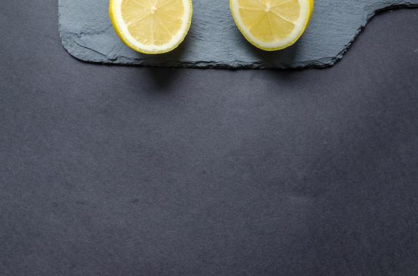 Two Sliced Lemons on Black Surface