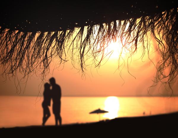 Under the umbrella - A couple kisses