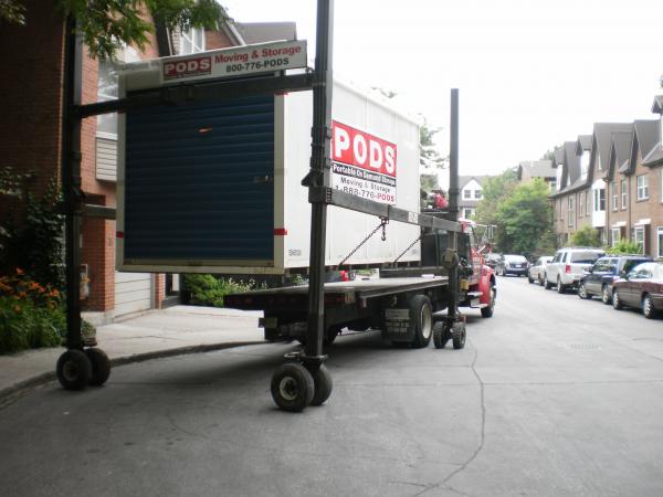 Unloading a shipping container with household contents -g