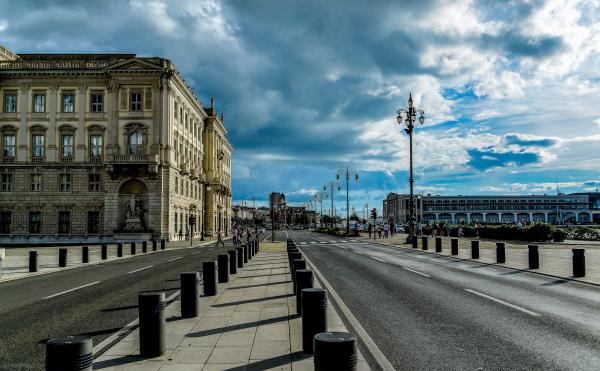 View of City Street Against Cloudy Sky
