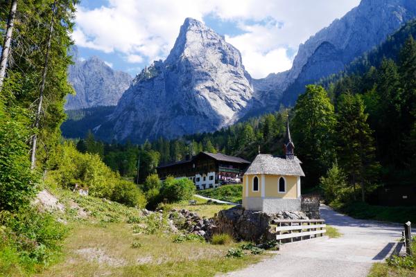 View of Village With Mountain Range in Background