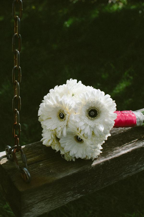 White Bouquet Flower on Brown and Grey Metal Outdoor Swing
