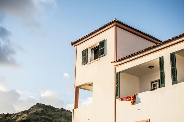 White Concrete House Under Blue Sky
