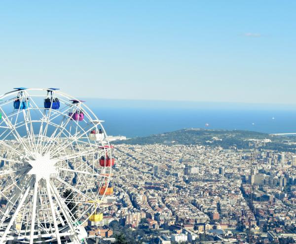 White Ferris Wheel Near Cityscape