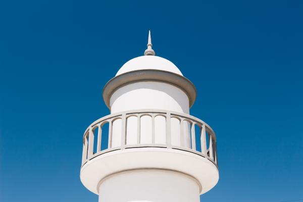 White Lighthouse Under Blue Sky