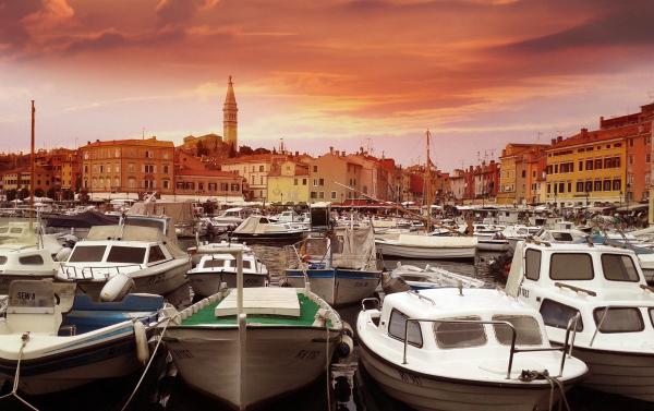 White Yachts on Body of Water during Sunset