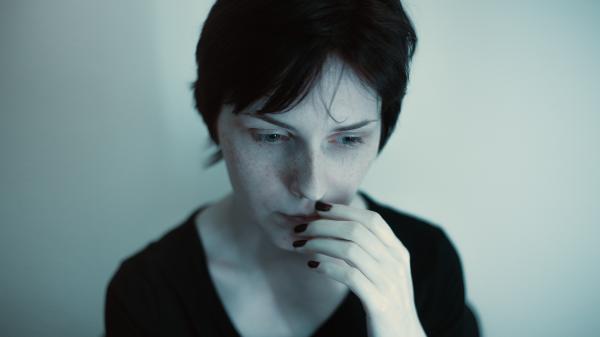 Woman Hands on Her Lips in Black Top