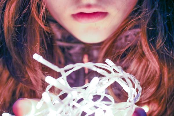 Woman Holding String Light