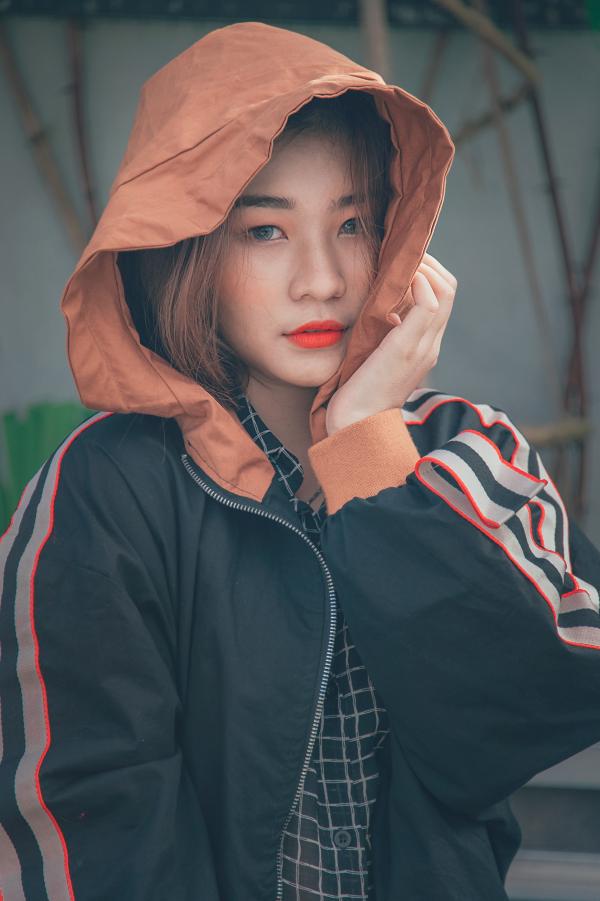 Woman in Black and Orange Zip-up Hoodie