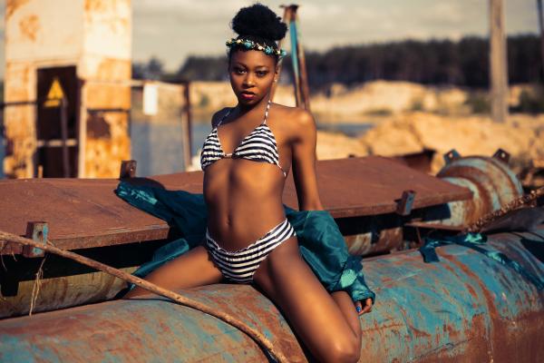 Woman in Black and White Striped Bikini Posing for a Photo