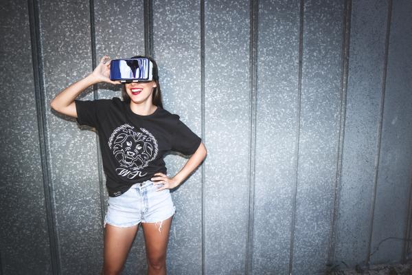 Woman in Black Crew-neck T-shirt Wearing Blue Vr Goggles