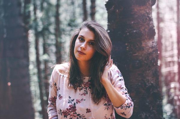 Woman In Floral Scoop-neck Blouse