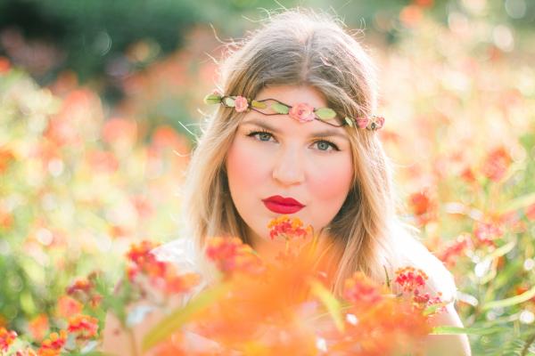 Woman in Flower Field Wearing Headband