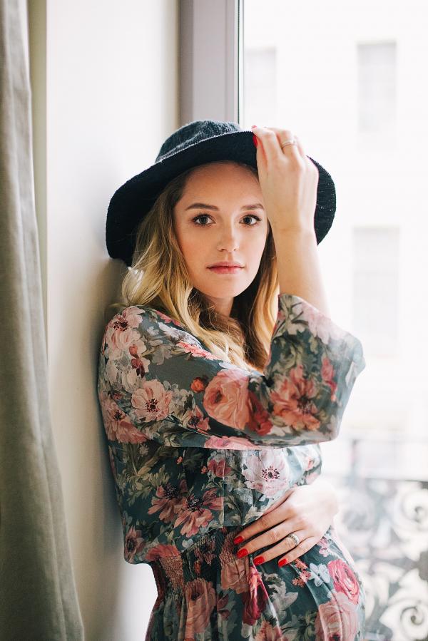 Woman in Multicolored Floral Long-sleeved Dress and Black Hat