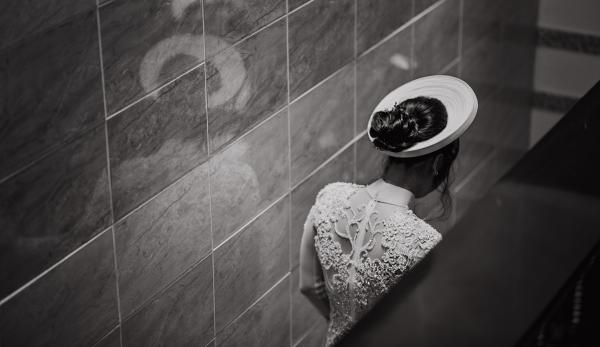 Woman in White Dress Standing Inside Room