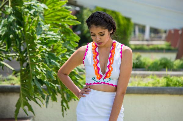 Woman In White Plunging Neckline Top And White Skirt