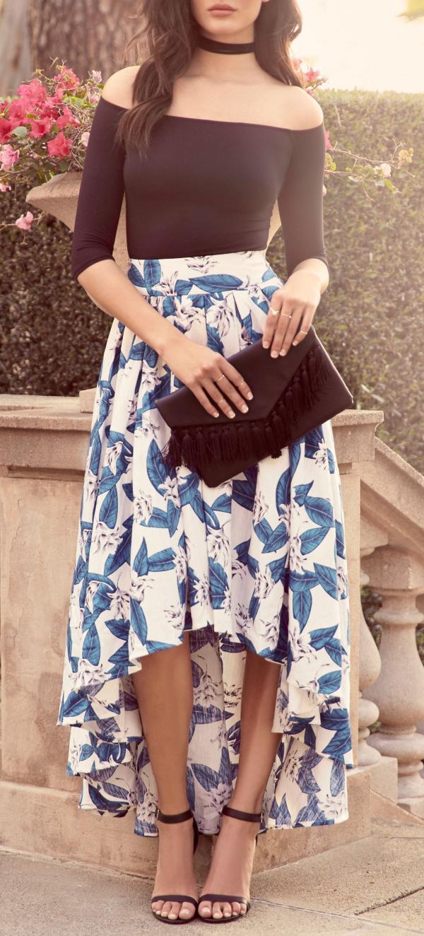 Woman in White Spaghetti Strap Top and Gray Skirt Standing in Front of Tree