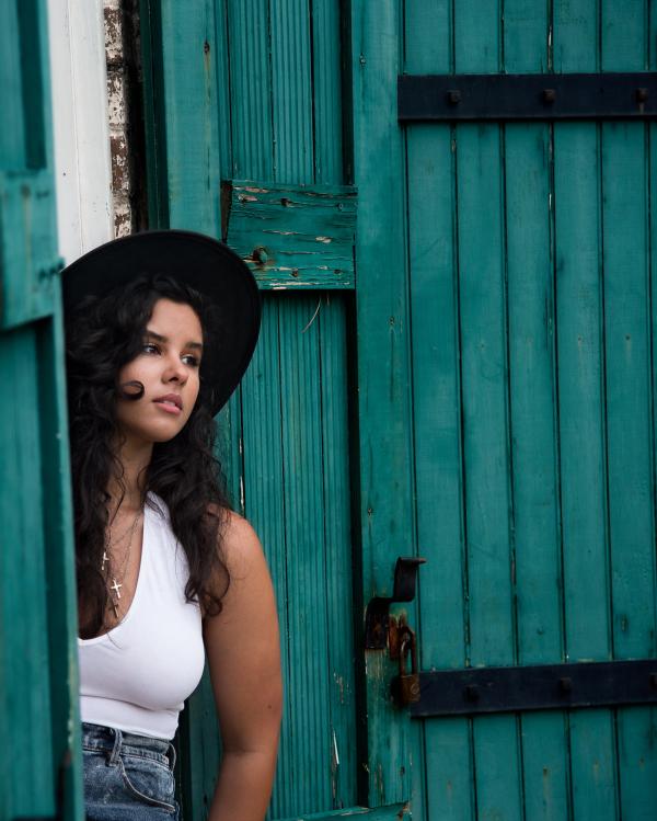 Woman in White Tank Tops and Blue Jeans