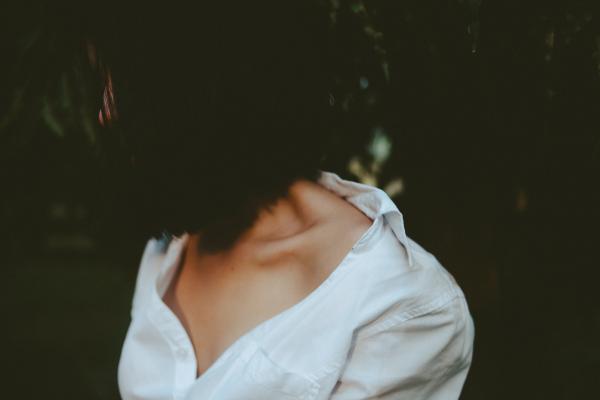 Woman in White V-neck Shirt