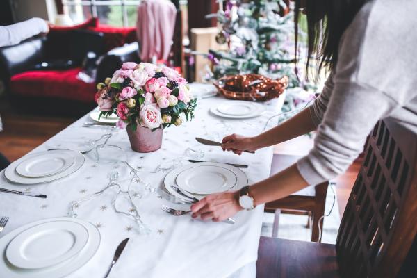 Woman Preparing Christmas Table
