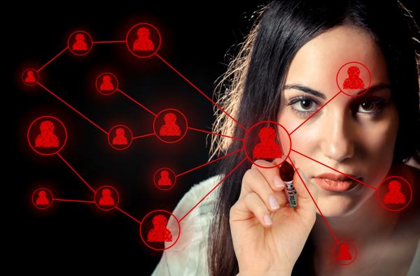Woman sketching a social network on virtual screen