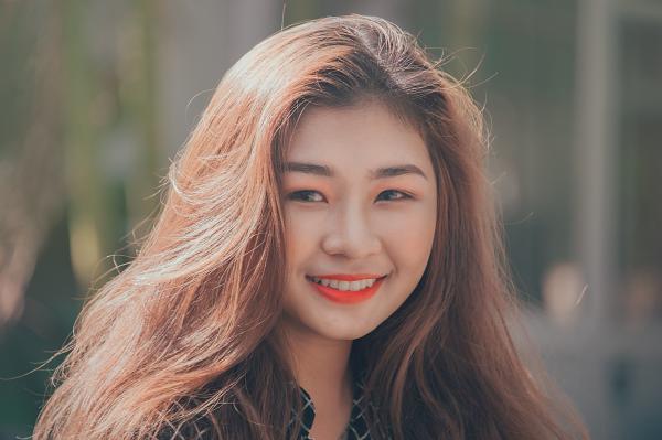Woman Smiling Wearing Red Lipstick