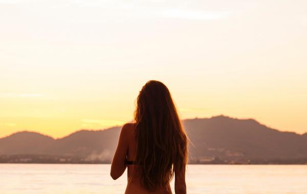 Woman Standing in Front of the Sea