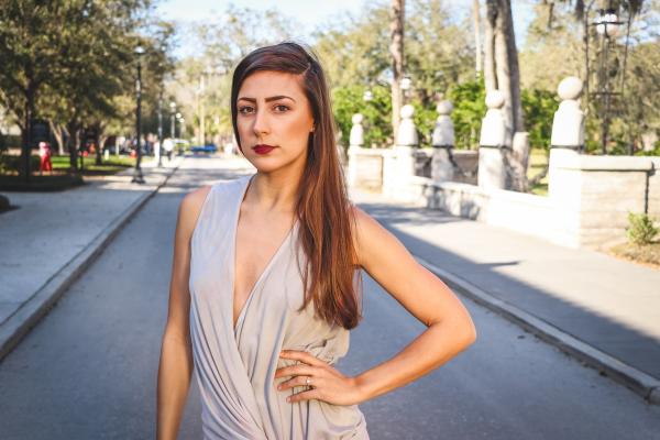 Woman Standing in the Middle of the Street