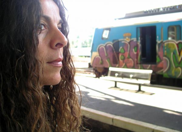 Woman waiting for train at station