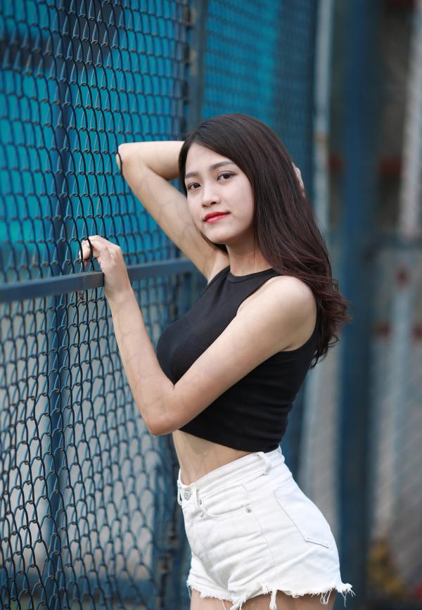 Woman Wearing Back Crop Top and White Short Shorts