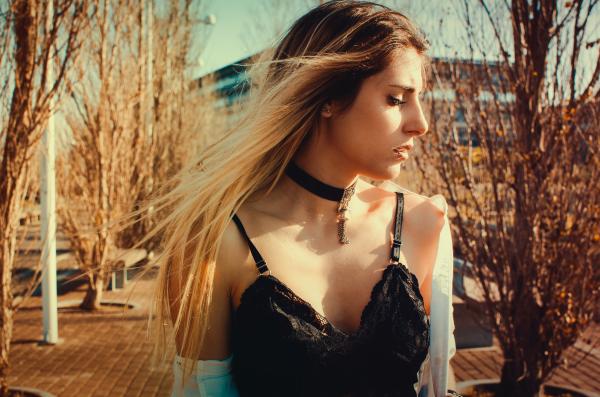 Woman Wearing Black Choker and Sleeveless Top Walking on Street