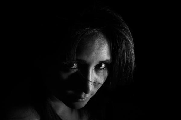 Woman Wearing Black Sleeveless Shirt With Black Background