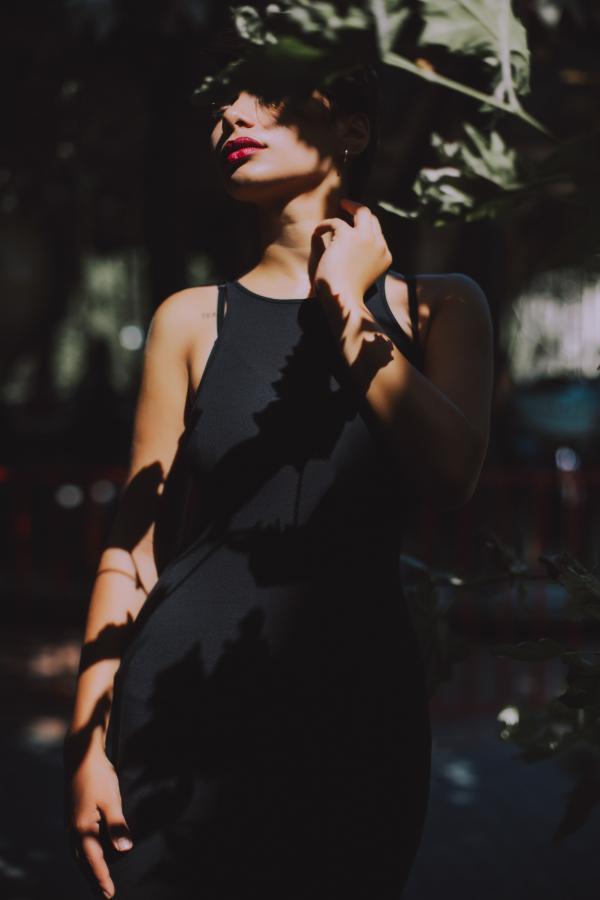 Woman Wearing Black Sleeveless Top Dress Under the Tree