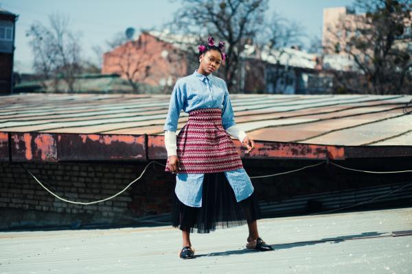Woman Wearing Blue and Red Long-sleeved Dress on Road