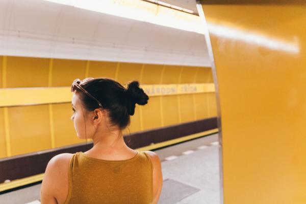 Woman Wearing Gold Sleeveless Top Inside the Building