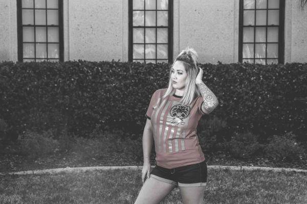 Woman Wearing Red Crew-neck Shirt With Black Short Shorts