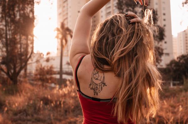 Woman Wearing Red Spaghetti Strap Top
