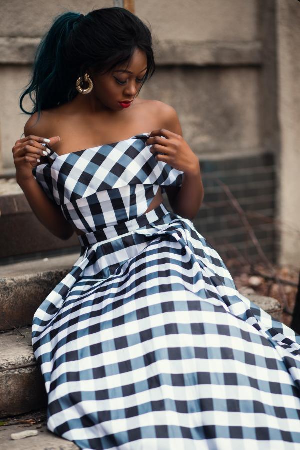 Woman Wearing Strapless Dress Sitting on Staircase