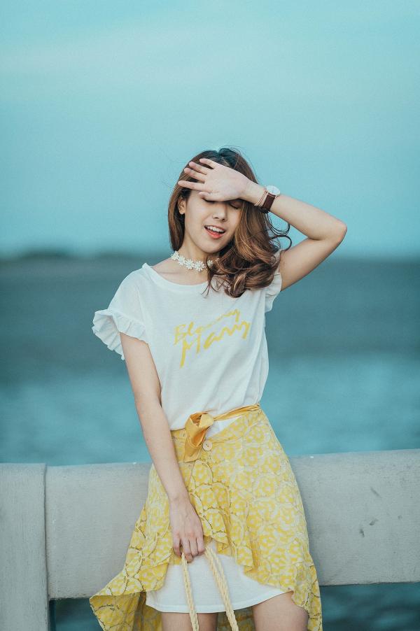 Woman Wearing White and Yellow Scoop-neck Mini Dress