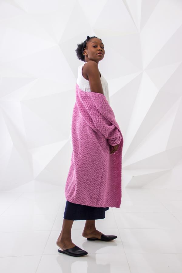 Woman Wearing White Sleeveless Dress and Pink Long Coa