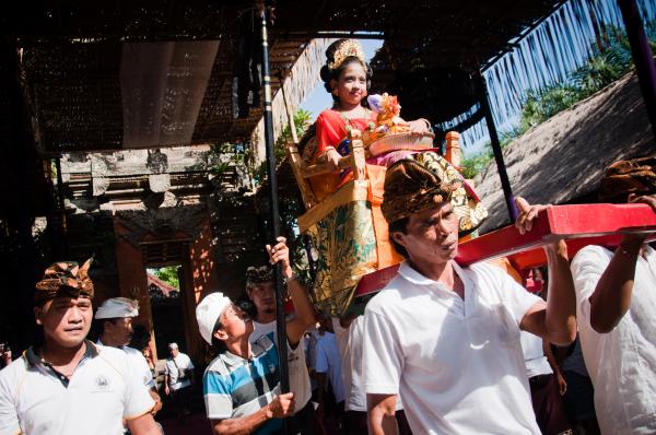women being carried in temple