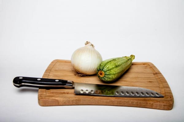 Wooden cutting board with vegetables